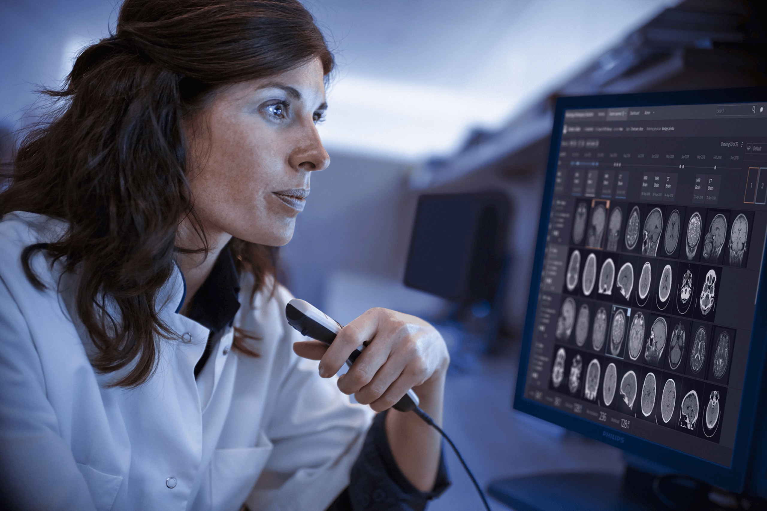 Radiologist reviewing medical images at a Philips workstation